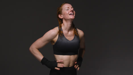 Studio-Shot-Of-Mature-Woman-Wearing-Gym-Fitness-Clothing-Doing-Mountain-Climber-Exercise-1